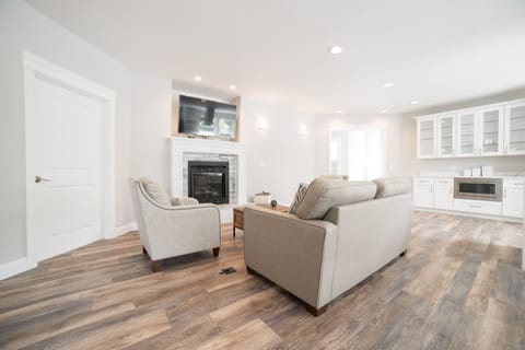 Gas fire place, large screen tv, comfortable seating, and a fold out couch bed.