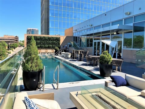 Soak up sunshine beside the sleek rooftop pool and loungers.