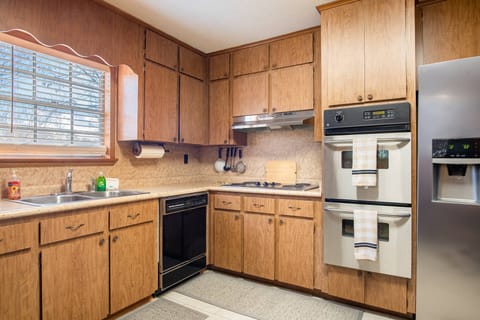 Enjoy a lovely fully furnished kitchen with a stove, double-oven, refrigerator, dishwasher, and other appliances to make meals a breeze