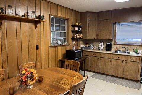 Stocked kitchen; grab your morning coffee and head to the covered porch!
