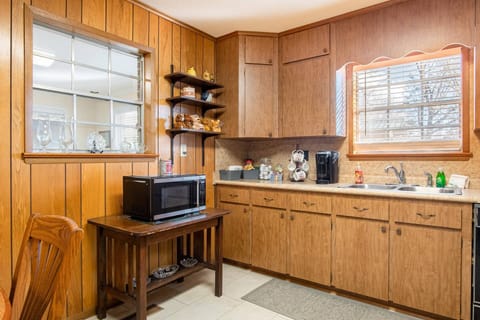 The kitchen has all the appliances you might need, including a microwave, Keurig single cup coffee maker, toaster, blender, and crockpot