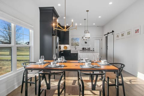 Chic dining table comfortably sits 6