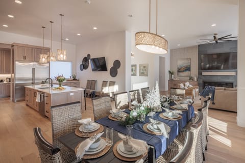 Dining Table, Kitchen, and Living Room - With an open and spacious floor plan, the dining room and kitchen can accommodate groups large or small for cooking, meals, and mingling.