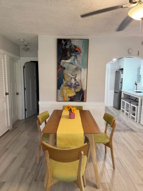 Dining area shows arches to kitchen and bath 1.