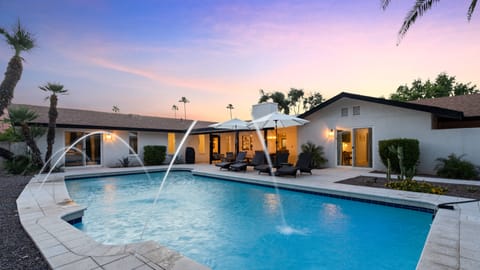 Huge backyard, pool, seating, corn hole