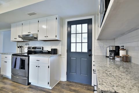 Kitchen has it all: modern cooking appliances & spacious countertops
