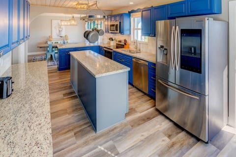 Experience the modern convenience of updated appliances and the elegance of granite countertops in your kitchen at Blue Water Paradise.