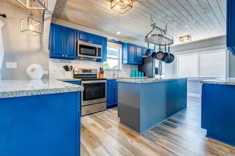 Experience the joy of meal preparation in a beautiful kitchen that enhances your culinary endeavors at Blue Water Paradise.