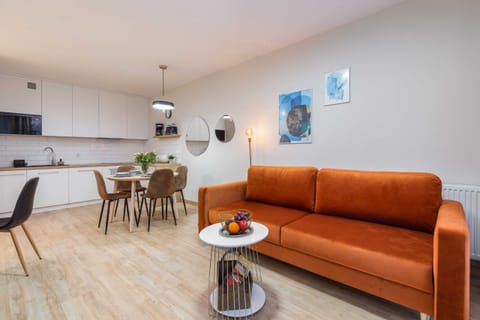 A seating area with an extremely comfortable sofa and TV.