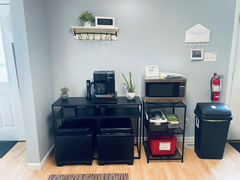 Coffee bar with Keurig and brew pot.