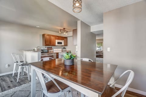Spacious dining area with a modern touch, perfect for enjoying meals together or planning your next adventure.