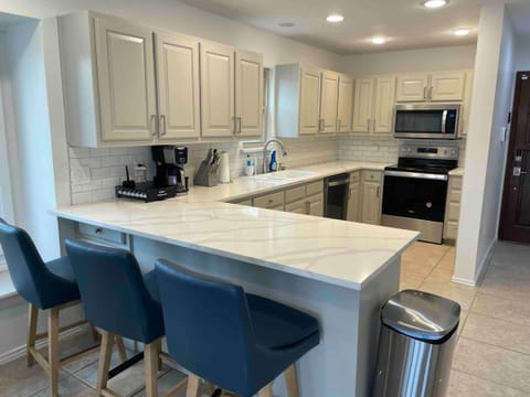 It is fully stocked with coffee, k-pods, pots, pans, cups, dishes,