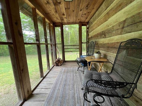Screened in porch looking out on private backyard. 