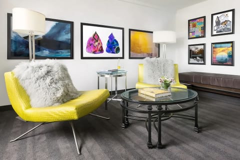 Gather on chic seating and enjoy art-filled, open space.