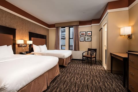 Imagine arriving to a spacious room with seating and soft tones.