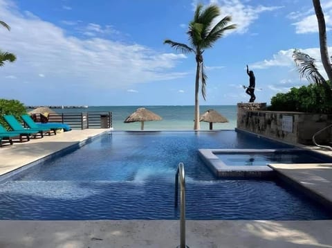 Shared resort pool overlooking the beach