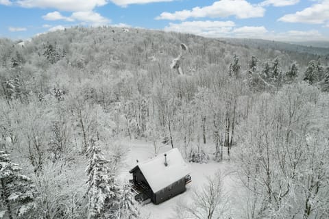 The house surrounded by fluffy white snow, 8 minutes to Mount Snow for skiing!