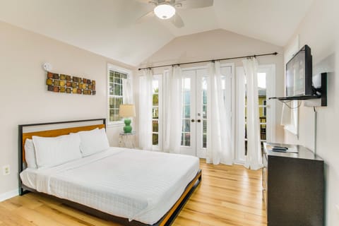 Dreamy upstairs bedroom with access to a balcony and streaming SmartTV.