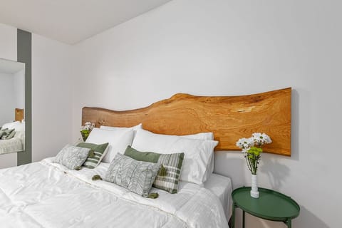King size bed with custom 8-foot white oak headboard