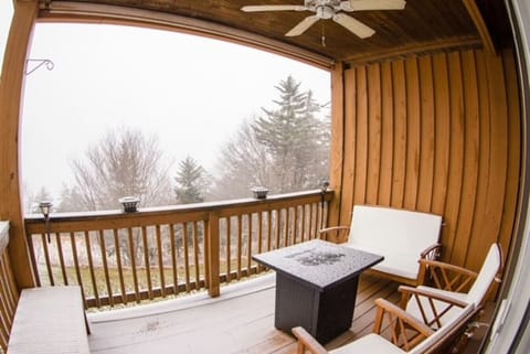 Propane fire pit with outdoor seating and ceiling fan, with beautiful second story views over multiple mountain ranges.