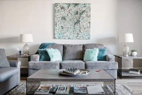 Queen sofabed in the living room. Custom abstract painting by local artist.