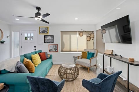 Cozy living room with convertible couch to a queen bed.
