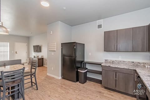 Fully equipped kitchen with modern appliances and ample space.