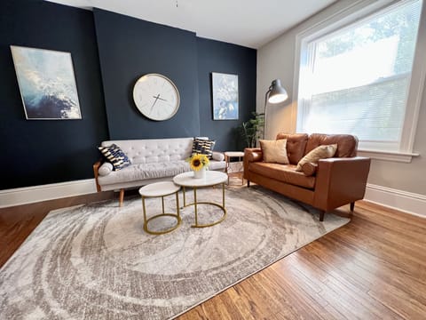 Bright living room with sofa and love seat.