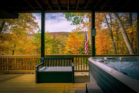 Relax & Unwind in the 6-person spa or deck bench to take in the fall foliage.
