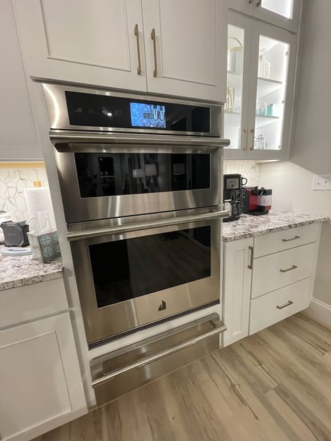 Top of the line JennAir convect/microwave wall oven combo with warming drawer.