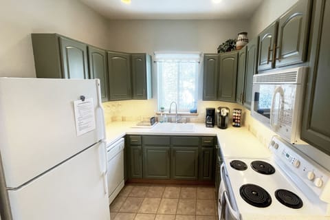 Fully stocked kitchen with views of open space, hiking/biking trails out back.