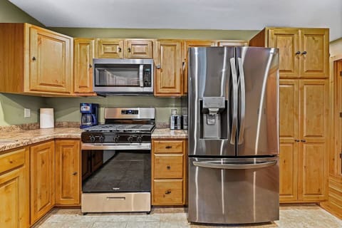 The kitchen is stocked with newer gas-burning stove, microwave and large fridge. A dishwasher makes clean up a breeze because it is vacation and who wants to do dishes!