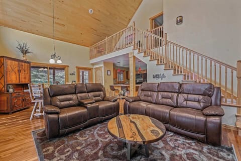 Open-concept living space is great for gathering with friends and family. Wood burning fireplace adds to the ambiance. You will love the little touches such as the wood and resin tables that were custom made for North Star Retreat