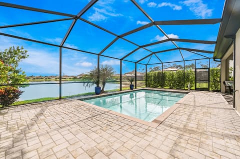 The private pool and overlooking the large lake at your back door