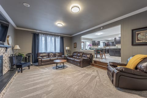 Spacious first floor living room with leather reclining furniture