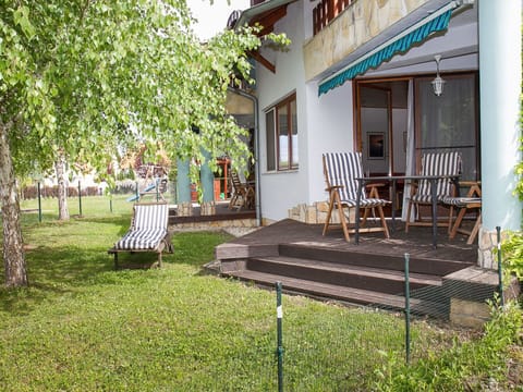 Plant, Building, Property, Window, Shade, Land Lot, Grass, Outdoor Furniture, Leisure, Door