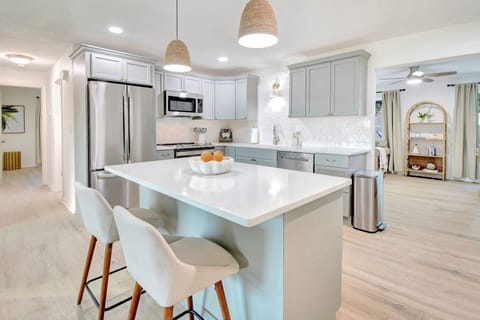Updated coastal kitchen with island for food prep or additional seating
