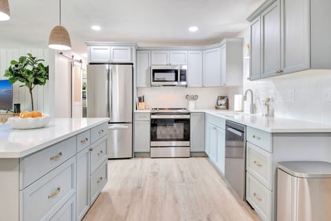 Brand new stainless steel appliances and premium cookware