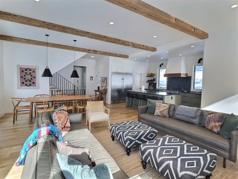 Full sitting area, kitchen and dining area view from the sunny window spot