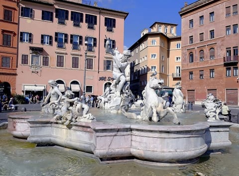 Explore vibrant plazas and fountains in the surrounding neighborhood.