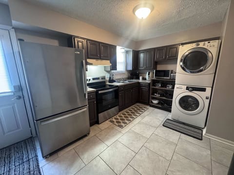 Kitchen: Enjoy the perks of our kitchen and laundry room combo, designed to give you the best of both worlds in a convenient way.