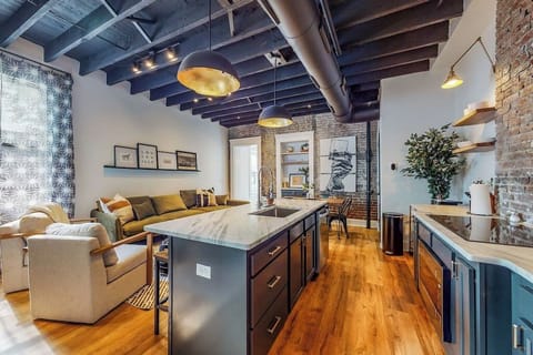 Kitchen: We made sure to design this area with an open layout that connects the living room, dining area, and kitchen, giving the whole space a seamless and roomy feel.