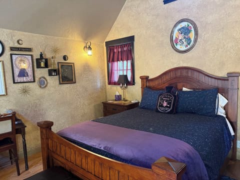Cozy rustic cabin bedroom at Whisper Canyon Ranch.