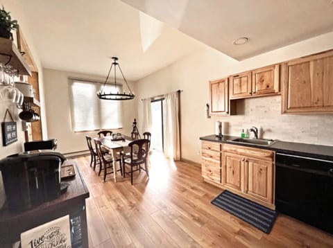 Open floorplan to dining area and screen door leading into game room.