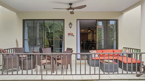 The shaded terrace of L511 has great views of the tropical landscaping and pools.