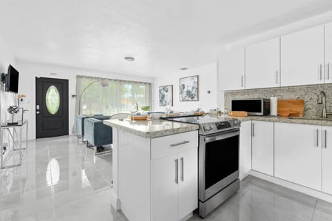 In the top left drawer you will find cooking utensils, underneath pots and pans, and to the right of the stove, bakeware, and kitchen appliances are t