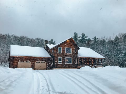 Embrace the beauty of winter as snow gently blankets the property, creating a peaceful and picturesque retreat.