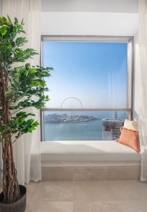 Lounge window suite with panoramic sea and Ain Dubai view