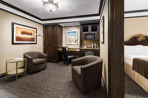 Unwind in the spacious sitting area with convenient wet bar.