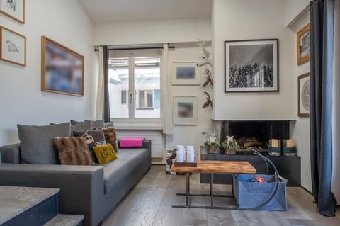 the charming living room in front of the fire place 